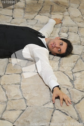 Image of Indoor portrait of young and happy  businessman