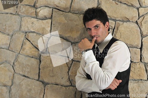Image of Indoor portrait of young and happy  businessman