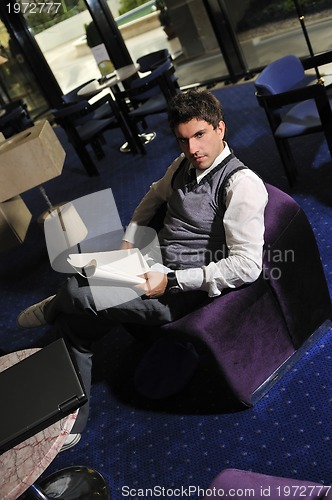 Image of young adult reading book
