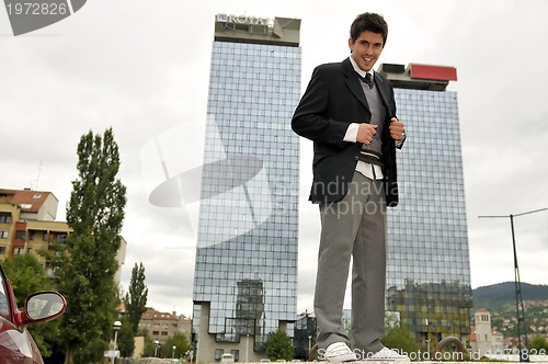 Image of Photo of happy winner businessman  screaming from joy