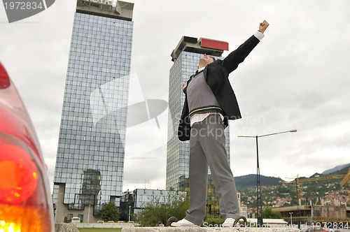 Image of Photo of happy winner businessman  screaming from joy