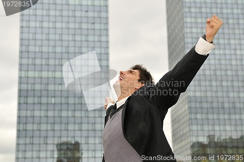 Image of Photo of happy winner businessman  screaming from joy