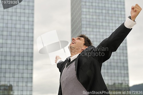 Image of Photo of happy winner businessman  screaming from joy