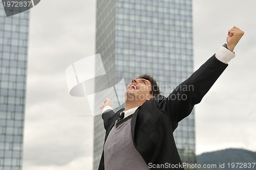 Image of Photo of happy winner businessman  screaming from joy