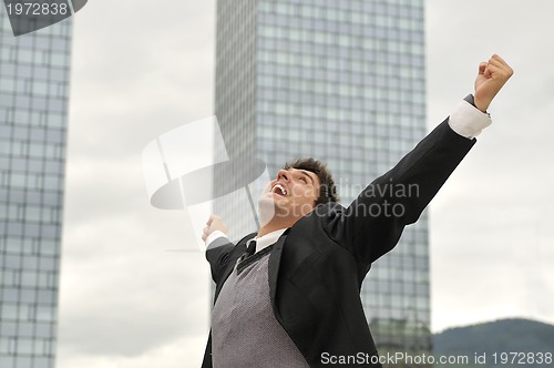 Image of Photo of happy winner businessman  screaming from joy