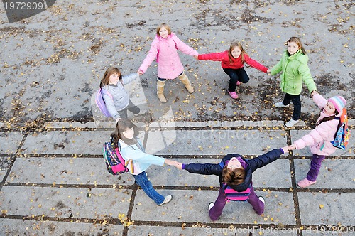 Image of friendship and teamwork concept with young schoolgirls group