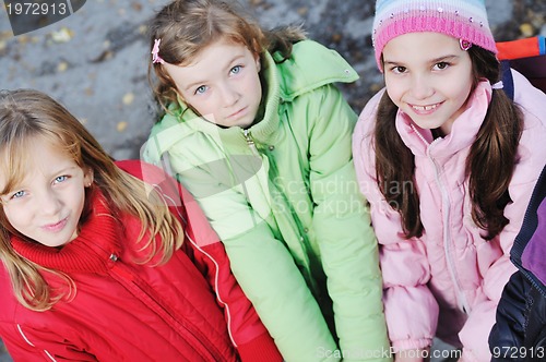 Image of friendship and teamwork concept with young schoolgirls group