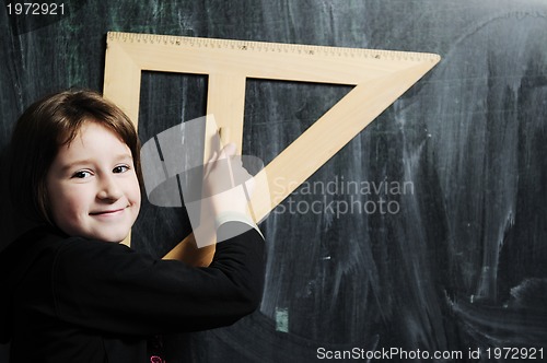 Image of happy school girl on math classeshappy school girl on math class