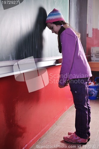 Image of happy school girl on math classes