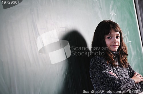 Image of happy school girl on math classes