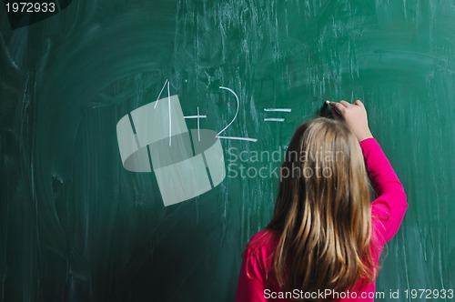 Image of happy school girl on math classes