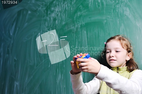 Image of happy school girl on math classes