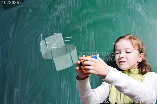 Image of happy school girl on math classes