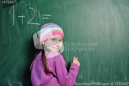 Image of happy school girl on math classes