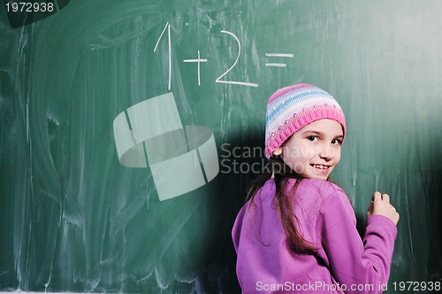 Image of happy school girl on math classes