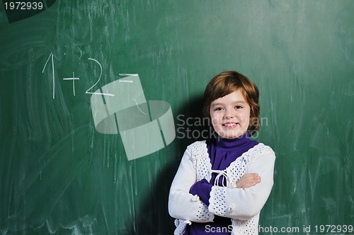 Image of happy school girl on math classes