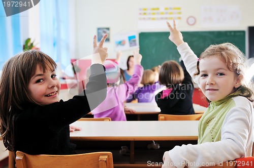 Image of happy teacher in  school classroom 