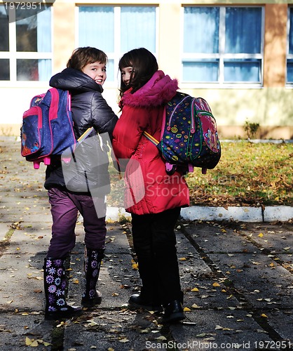 Image of school girls running away 