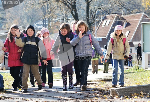 Image of school girls running away 