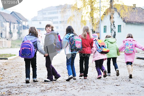 Image of school girls running away 