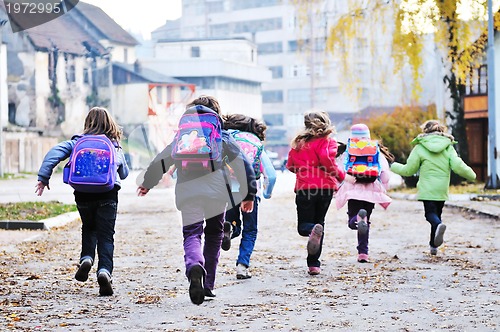 Image of school girls running away 