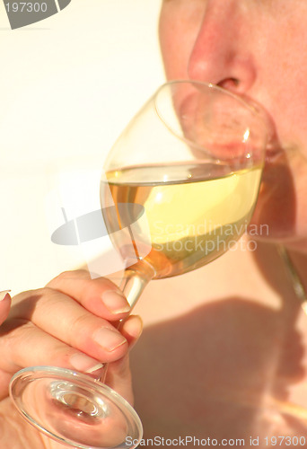 Image of relaxing  with a glass off wine