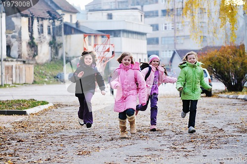 Image of school girls running away 