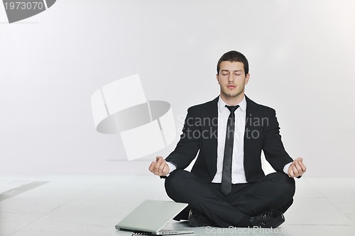 Image of business man practice yoga at network server room