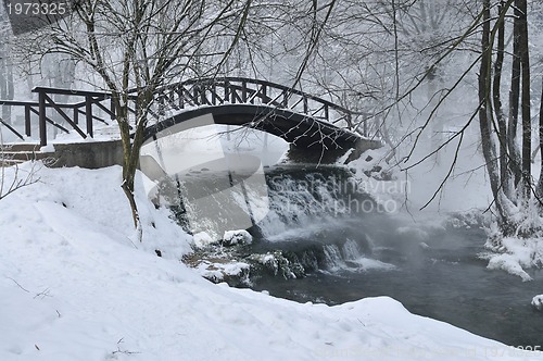 Image of small wooden bridge at winter