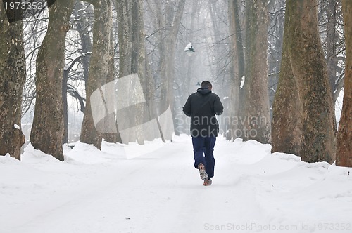 Image of one older man running at alley 