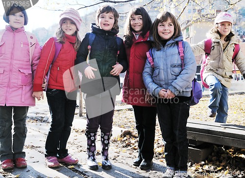 Image of school girls running away