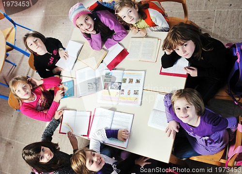 Image of happy kids with  teacher in  school classroom