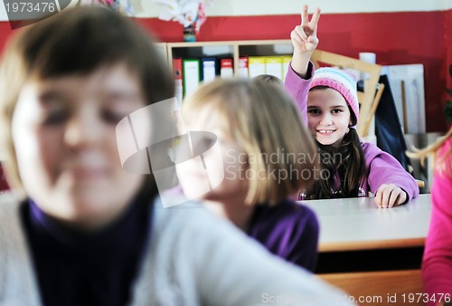 Image of happy kids with  teacher in  school classroom