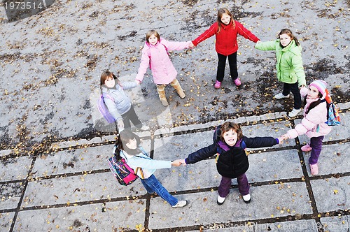 Image of school girls running away