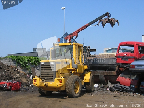 Image of Loading car into crusher