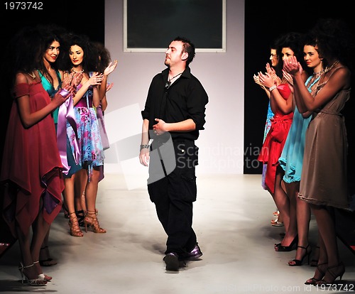 Image of young fashion designer on the stage