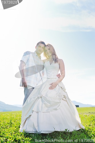 Image of beautiful bride outdoor with colorful windmill toy