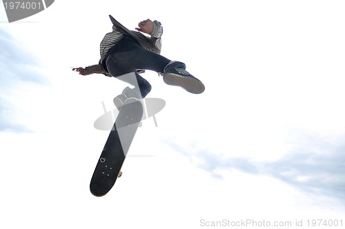 Image of Boy practicing skate in a skate park - isolated