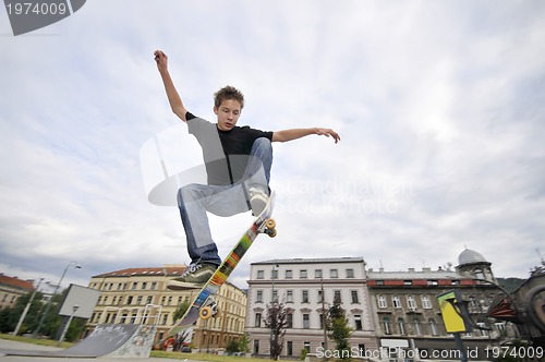 Image of Boy practicing skate in a skate park 