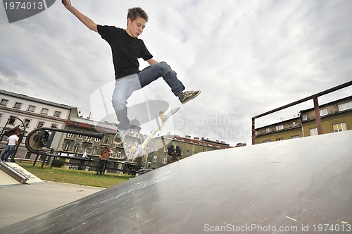 Image of Boy practicing skate in a skate park - isolated