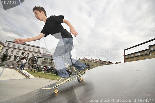 Image of Boy practicing skate in a skate park - isolated