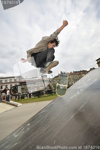 Image of Boy practicing skate in a skate park - isolated