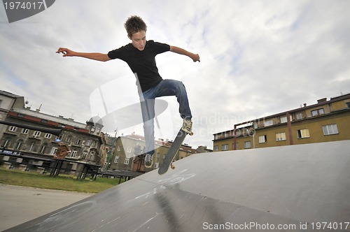 Image of Boy practicing skate in a skate park 