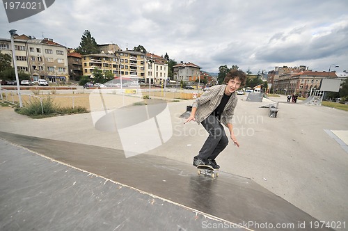 Image of Boy practicing skate in a skate park - isolated