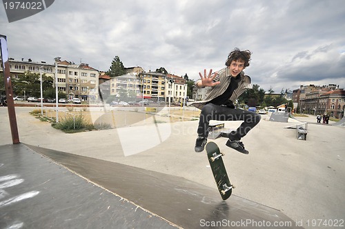 Image of Boy practicing skate in a skate park - isolated