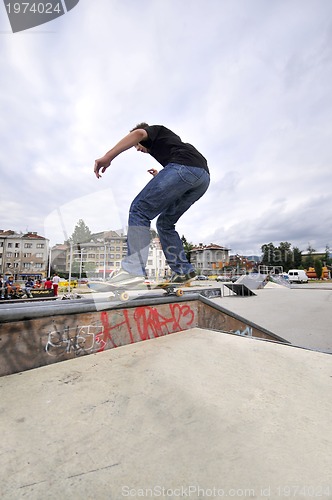 Image of Boy practicing skate in a skate park - isolated