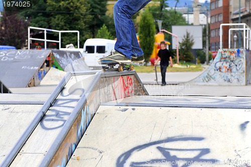 Image of Boy practicing skate in a skate park