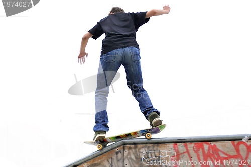 Image of Boy practicing skate in a skate park - isolated