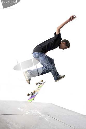 Image of Boy practicing skate in a skate park - isolated