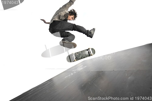 Image of Boy practicing skate in a skate park - isolated